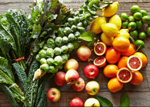 a group of fruits and vegetables on a wood surface Healthy Weight Loss Diets Calton