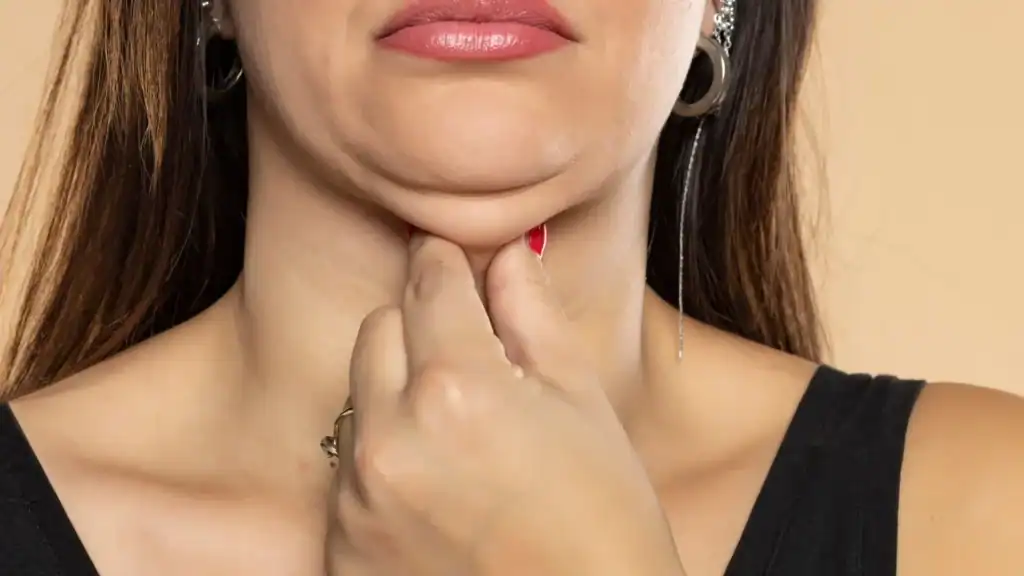 An image of a woman with double chin, sad, worried : Non Surgical Double Chin Removal Treatment in Calton, UK